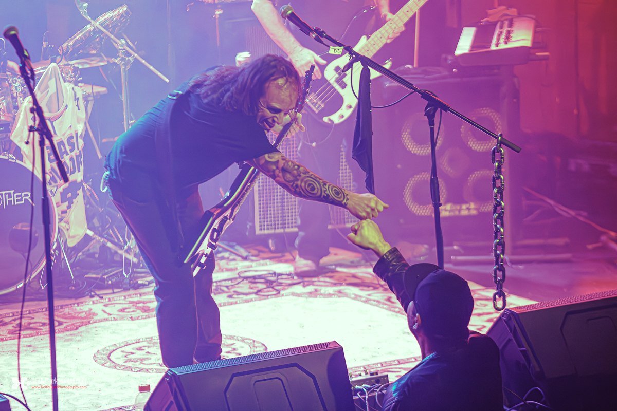 The singer bent double at the lip of the stage, reaching down to meet a fan&rsquo;s raised fist